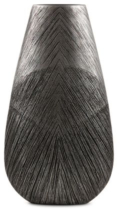 a black vase is sitting on a white surface with lines drawn across the top and bottom