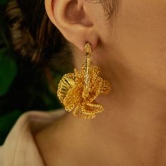 These fun ruffled, hand-crocheted hoops were fabricated by highly skilled Brazilian artisans. They feature shiny gold wire is supplemental to the fine craft artwork spent in every piece of our jewelry. They feature 18 karat gold filled copper wire and create a statement look without the weight or bulk! These are very comfortable to wear and perfect for every occasion, from day to day use or even a more special celebration! Made from non-allergenic (hypoallergenic) and nickel-free. Stunning jewelry that will last for a lifetime. Each pair of earrings takes hours to finish. The result is a remarkable piece of jewelry. This piece is 100% Hand Crocheted made with 18k Gold filled wire in Brazil. This is an authentic piece of Lavish Jewelry by Tricia Milaneze and it was handcrafted with noble an