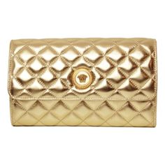 This wallet on chain from Versace is crafted with a luxuriously soft quilted lambskin in a metallic gold color. The front face of the bag features a gold-tone Medusa head logo. The magnetic snap flap opens to a black fabric lined interior with card slots, bill slots, and a zipper compartment, providing ample organization. The detachable chain strap allows for this piece to be worn as a shoulder bag or clutch. This chic wallet on chain is the perfect evening or special occasion bag, only from Ver Metallic Gold Color, Versace Handbags, Medusa Head, Versace Bags, Wallet On Chain, Chain Wallet, Wallet Chain, Wallet Bag, Quilted Leather