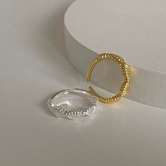 Presenting the Seashell Silver & Gold Plated Adjustable Ring, an extension of our Seashell Pearl Earrings line. This dainty gold ring captures the calm and allure of the sea, featuring a sterling silver open ring adorned with five beautifully etched seashells.  The ring is adjustable, accommodating SIZE US 5-8, making it a versatile addition to any jewelry collection. The seashells, intricately carved into the surface of the ring, evoke a sense of tranquility and the timeless beauty of nature. I Ocean Inspired Jewelry, Dainty Gold Rings, Shell Ring, Seashell Jewelry, Gold And Silver Rings, Gold Gold, Gold Plated Rings, Open Ring, White Gold Rings