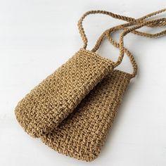 two woven bags sitting on top of each other