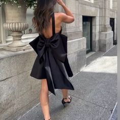 Zara Bow Trim Voluminous Satin Effect Dress. Straight Neckline. Large Back Bow. Side Hidden In-Seam Zip Closure. Color Black. 3510/748. Outer Shell 97% Polyester, 3% Elastane. Lining 100% Acetate. Size M. Armpit To Armpit 16” Waist 15” Length Approx 35”. New With Tags Bow Dress, Straight Neckline, Zara Black, Dress With Bow, Zara Dresses, Black Color, Zara, Satin, Trim