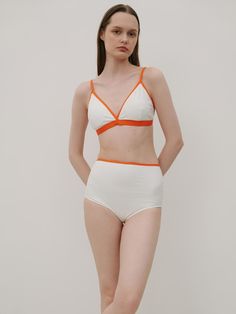 This is a feminine and modern bikini by 320SHOWROOM that is made out of high quality and sturdy fabric. With unique design detail and trendy mood, you can style it for your modern and casual daily outfit.- Color contrasting piping line detail- High waistline- Inner bra pad and triple hooks- Adjustable shoulder strap length Modern Fitted High-waist Swimwear, Modern High Waist Swimwear For Summer, Modern White Swimwear For Summer, White Seamless Summer Bottoms, Chic Seamless White Bottoms, Chic White Seamless Bottoms, Modern White Bottoms For Summer, Modern White Summer Bottoms, White High-waist Swimwear With Built-in Bra