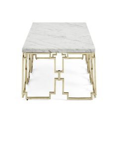 a white marble top coffee table with gold metal frame and geometric design on the bottom