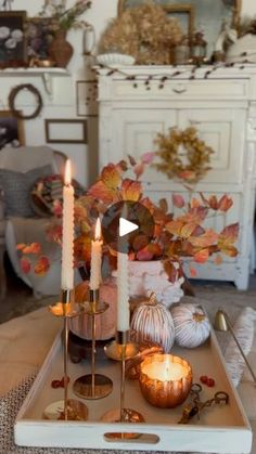 a tray with candles and other decorations on it