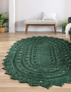 a green rug on the floor in a living room