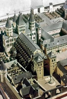 an aerial view of a large building with many spires and towers in the city