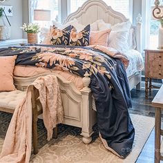 a bedroom with a large bed and lots of pillows