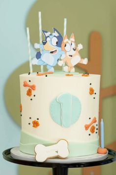 a cake decorated with cartoon characters on it