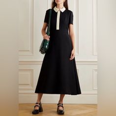 There's An Effortless Elegance To Valentino's Pre-Fall '22 Collection That Creative Director Pierpaolo Piccioli Says Has Roots In The '70s. This Dress Is Cut From Two-Tone Virgin Wool And Silk-Blend Crepe In An A-Line Shape. The Zip-Fastening Collar Is Embellished With The House's Hallmark 'Rockstud' Fits True To Size, Take Your Normal Size Designed To Be Slightly Fitted At The Bust And Waist, Loose At The Hip Mid-Weight, Slightly Stretchy Fabric Black And Ivory Wool And Silk-Blend Crepe Zip Fas Classic Black A-line Maxi Dress, Black Midi Length Dresses For Semi-formal Occasions, Luxury Semi-formal Dresses, Classic Black Semi-formal Dress, Black Semi-formal Midi Dress, Black Fitted Maxi Dress For Office, Luxury Black Midi Dress For Spring, Fitted Black Maxi Dress For Office, Designer Midi-length Dresses