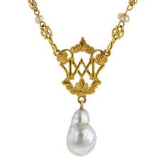 An ornate, openwork plaque with letters, accented by a filigree link chain stationed with fresh water pearls and finished with baroque pearl drop, pendant measures 1 3/4 inches long, fashioned in 18k yellow gold (tested) with 10k yellow gold clasp. Circa 1880. Length 16 inches. Antique Pearl Necklace With Pearl Pendant For Formal Occasions, Antique Pearl Pendant Necklace For Formal Occasions, Victorian Pearl Chain Necklace For Formal Occasions, Antique Formal Pearl Chain Necklace, Ornate Baroque Yellow Gold Jewelry, Antique Pearl Chain Jewelry For Formal Occasions, Antique Pearl Chain Necklace For Formal Occasions, Formal Antique Pearl Drop Necklace, Luxury Baroque Pearl Drop Jewelry