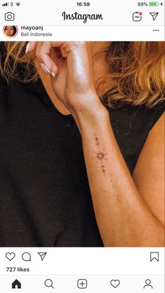 a woman with a small star tattoo on her arm