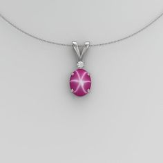 Handmade 925 sterling silver star ruby necklace features a star ruby gemstone accented by white diamond. The star ruby cabochon displays a 6-ray floating star (when exposed to direct sunlight). The gemstones are set in a solid sterling silver oval-shaped pendant setting. Free gift box with purchase of this vintage-style pendant.Main Gemstone: Star RubyGemstone Size: 8 x 6 mmGemstone Weight: ~2.3 CaratsGemstone Color: Pink (Floating Star)Gemstone Origin: Lab-CreatedAccent Gemstone: DiamondGemston Mexican Fire Opal Ring, Silver Pendent, Ruby Necklace Pendant, Blue Star Sapphire, Fire Opal Ring, Ruby Pendant, Pendant For Women, Ruby Necklace, Star Ruby