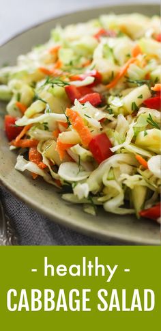 healthy cabbage salad with carrots, celery and parsley on a plate