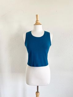 Womens basic cropped cotton knit tank top.  This is a simple semi fitted cropped length tank top that can be worn alone or layered. Made of soft stretchy cotton Lycra fabric. Machine washable.  Length from shoulder to hem is about 17.5" on size Small and increases 1/2" each size up.    See swatch chart in the last photos for available colors.  Garments are Made To Order Please allow 7-10 days for your item to be sewn Below are my standard size measurements, which are simply a guideline, if you would like to include your personal measurements in the notes to seller box during checkout, I will be sure to make you the best fit ~ if you have any questions feel free to ask :)  BASIC SIZING   XSmall 0-2 Bust 33-34, Waist 25-26, Hip 35-36  SMALL 4-6 Bust 35-36, Waist 27-28, Hip 37-38  MEDIUM 8-10 Cotton Cropped Hem T-shirt For Summer, Casual Seamless Crop Top For Everyday, Cropped Athleisure Tank Top For Everyday, Everyday Cropped Athleisure Tank Top, Seamless Stretch Cropped T-shirt, Summer Athleisure Crop Top With Crew Neck, Sporty Crop Top For Everyday Summer Wear, Casual High Stretch Crop Top For Summer, High Stretch Casual Summer Crop Top