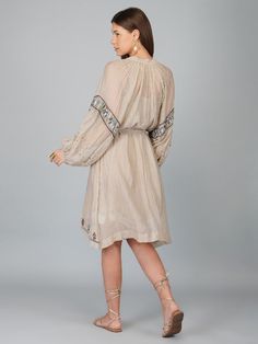 Loose fit big sleeve dress is adorned with sequin work and comes with a separate belt and slip Color: Beige Fabric: Chanderi Note: Wash Care - Dry Clean only The product will be delivered within 3-4 weeks of order placed Relaxed Fit Festive Knee-length Embroidered Dress, Festive Embellished Knee-length Midi Dress, Spring Embellished Long Sleeve Midi Dress, Spring Long Sleeve Embellished Midi Dress, Spring Knee-length Embellished Embroidered Dress, Spring Embellished Knee-length Embroidered Dress, Floral Embroidered Tunic Dress For Daywear, Embroidered Tunic Dress For Daywear, Floral Embroidery Tunic Dress For Daywear