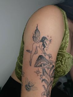 a woman with a tattoo on her arm