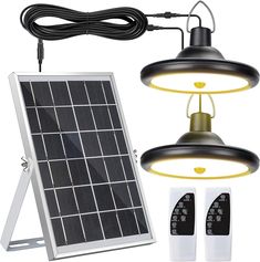 the solar powered light is next to an outdoor lamp