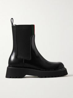 Gucci's 'Thea' boots are trimmed with signature webbing stripes along the cuffs, making them instantly recognizable to fans of the house. Crafted in Italy from glossed-leather, they're set on chunky rubber lug soles and have elasticated inserts for easy on-and-off. Winter Work Wear, Shoes Boots Ankle, Black Chelsea Boots, Ballet Pumps, Leather Chelsea Boots, Boot Pumps, Shearling Jacket, Ski Wear, Clothes Collection