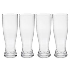 four tall glass vases are lined up in a row