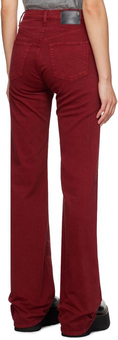 Slim-fit straight-leg overdyed stretch denim jeans. · Belt loops · Five-pocket styling · Zip-fly · Flared cuffs · Leather logo patch at back waistband Supplier color: Vivid red stretch Classic Red Straight Leg Bottoms, Red Classic Straight Leg Bottoms, Red Wide Leg Jeans For Work, Red Relaxed Fit Jeans For Fall, Casual Burgundy Straight Leg Bottoms, Red Straight Leg Jeans For Work, Casual Burgundy Straight Leg Jeans, Red Straight Cotton Jeans, Burgundy Straight Leg Cotton Jeans