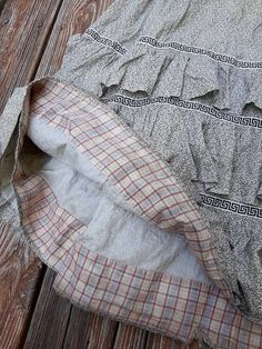 "Antique cotton floral calico everyday work skirt c.1860-70. With tiered ruffle skirt and a striking Greek key ribbon decoration. Inner hem lined in sweet cotton plaid. Side pocket. Fixed waistband with milk glass button. Good wearable antique condition. Expected signs of wear and age. There are faint marks and discoloration to the skirt. A few very small holes. There are some holes near the waistband and some rough inner stitching. Hole behind the button. Waist 25\" max Length 39\"" Peasant Cotton Skirt With Ruffles, Cotton Gingham Skirt With Ruffles, Cottagecore Cotton Skirt With Ruffles, Vintage Plaid Cotton Skirt, Plaid Ruffled Cotton Skirt, Plaid Cotton Skirt With Ruffles, Vintage Cotton Ruffle Skirt, Vintage Ruffled Cotton Skirt, Vintage Cotton Skirt With Ruffles