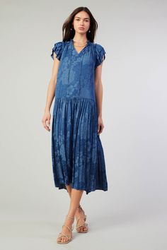 This jacquard maxi dress feels particularly breezy thanks to the dropped waist and shin-skimming pleats. Done in Parisian blue with a floral motif woven in, it's got a sweetly tied neckline, smocked detailing, and tiered short sleeves edged by picot stitching. " •Split neckline with self-tie •Relaxed fit •Ruffle trim •Short sleeves •Dropped waist •Pleated skirt •Mid-length hem DIMENSIONS •Standard: 50 Length Item number 2090410-1 100% Polyester Hand Wash Cold Spring Blue Pleated Dress, Blue Pleated Dress For Spring, Blue Pleated Dress With Pleated Hem For Spring, Casual Spring Maxi Dress With Pleated Hem, Casual Blue Dress With Pleated Hem, Parisian Blue, Floral Jacquard, Drop Waist, Ruffle Trim