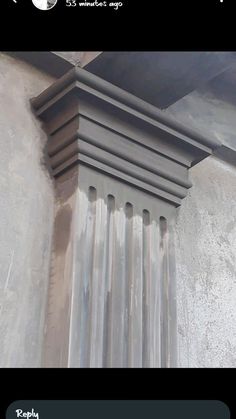 the corner of a building with columns on it