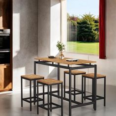 a kitchen table with four stools in front of it