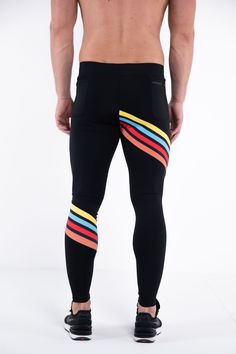 the back view of a man in black leggings with multicolored stripes