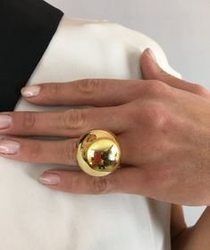 An amazing adjustable size Gold Sphere Ring, that is truly eye catching. Simple , elegant and modern. A lovely piece that is easy to wear and always leaves an impression. Not made of real gold. Also available in silver Statement Gold Ring, Sphere Ring, Gold Sphere, Leather Face Mask, Gold Bubbles, Bubble Ring, Beautiful Belts, Contemporary Ring, Circle Ring