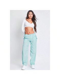 Getting dressed is a cinch with our Women's Relaxed Fit Nylon Parachute Pants. These high-waisted nylon pants feature a relaxed, slouchy fit for a cool look and comfy feel. Features bungee ties at the waist and hem for optional cinching, a front zip fly with hidden button closure, and snap button flap pockets at the front and back. Detailed with subtle layered pleats on the front. Style this pant with a fitted top and sneakers for a sporty-chic vibe. 

Product Details
- High Rise 
- Front Zip Fl Trendy Solid Straight Leg Parachute Pants, Spring Baggy Solid Parachute Pants, Trendy Solid Parachute Pants With Side Pockets, Trendy Spring Parachute Pants With Cargo Style, Trendy High-waisted Parachute Pants For Spring, Trendy Baggy Solid Parachute Pants, Trendy Baggy Parachute Pants, Trendy Relaxed Fit Straight Leg Parachute Pants, Solid Color Parachute Pants With Cargo Pockets For Spring