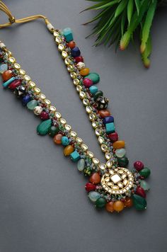 Multicoloured Navrattan Kundan Inspired Necklace with Earrings. This beautifully handcrafted necklace is set in silver and copper alloy and plated with 22k gold. This necklace with a twist of Pearl stones by Paisley Pop is a perfect accessory for an Indian Bride. Necklace Size - Length 16 inc, Width 1.5 inc Closure - Adjustable Thread Dori Style Tip - Wear this with almost anything Indian for a rich and royal look because nothing more regal than kundan necklace set. We love teaming this with cla Indian Jewelry Earrings, Sabyasachi Jewellery, Antique Jewelry Indian, Indian Jewelry Sets, Inspired Necklace, Jewelry Design Earrings, Fancy Jewellery, Handcrafted Necklace, Jewelry Design Necklace