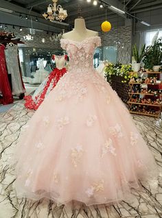 Silhouette:ball gownHemline:floor lengthNeckline:off the shoulderFabric:tulleSleeve Style:sleevelessColor:pinkBack Style:lace upEmbellishment:appliques beading