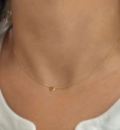 Solid 14K Heart Necklace, DINTY 14k Gold Heart, Tiny Heart Necklace, Solid Gold Jewelry, Gold Heart Necklace, Graduation Gift, Gift for Mom. This beautiful dainty solid 14k gold heart necklace is the perfect gift and great for any occasion. Beautifully worn on its own or layered with other necklaces. 14k (yellow) solid gold heart measures 8mm and is centered on a delicate shimmering cable chain. PLEASE convo me for custom orders. :) **PLEASE NOTE: THIS LISTING IS ONLY FOR ONE NECKLACE **All PHOTOS ARE ENLARGED TO SHOW DETAIL. **PROPS NOT INCLUDED. ** ♥ REAL SOLID 14KT GOLD. THIS ITEM IS NOT PLATED OR FILLED. ♥ 🎁 Comes ready to gift in a gift box or pouch. ♥BUY WITH CONFIDENCE♥ Please know I take customer service very seriously! There is nothing I want more than a happy customer and! If yo Small Gold Heart Necklace, Cheap Gold Heart Beads Jewelry, 14k Gold Heart Necklace With Delicate Chain For Anniversary, Dainty Yellow Gold Jewelry With Heart Detail, 14k Stamped Heart Necklace For Wedding, Delicate Tiny Gold Heart Necklace, Valentine's Day 14k Gold Heart Cut Charm Necklaces, Valentine's Day 14k Gold Heart Cut Charm Necklace, Dainty 14k Stamped Necklaces For Valentine's Day