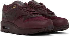 Low-top paneled suede and grained leather sneakers in burgundy. · Lace-up closure · Textile logo patch at padded tongue · Padded collar · Swoosh appliqué at sides · Logo embossed at heel counter · Air Sole unit at rubber midsole · Treaded rubber outsole Please note that this item may be shipped only within North America. Supplier color: Crush/Burgundy Nike Burgundy, Nike For Women, Nike Clothing, Nike Sale, Textile Logo, Burgundy Lace, Color Crush, Air Max 1, Nike Outfits