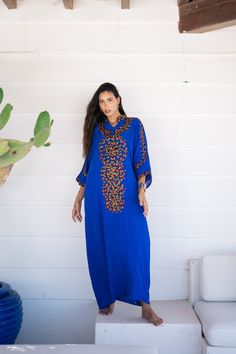 *Note : The kaftan in the video is a different color and is only displayed to show the fit, flow, and cut of the Kaftan. You will receive the one in the pictures.* A bohemian flash caftan made of light mesh of linen and poly, the fabric is unique in that it's very flowy and not the usual feel and touch of linen. This Kaftan is ideal to wear for any casual occasion. Whether taking a trip down the shopping lane, or home-based kitty parties, or about anything else, wearing this dress will make you Blue Bohemian Kurta With Resham Embroidery, Blue Bohemian Embroidered Dress For Festive Season, Long Blue Cotton Kaftan, Blue Tunic Kurta For Festivals, Embroidered Maxi Length Blue Abaya, Blue Embroidered Long Abaya, Blue Tunic Thobe For Eid, Blue Cotton Kaftan In Free Size, Blue Cotton Long Sleeve Kaftan