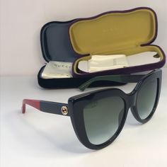 Gucci Cat Eye Sunglasses Gg0164s Black This Is An Authentic Pair Of Gucci Cat Eye Sunglasses Gg 0164/S In Black. These Sunglasses Are Black And Have Large Rims With Lenses In Gradient Gray. The Arms Feature A Brass Interlocking Gg Logo At The Temple And A Bee At The End With Color Block Temples Of Black And Green On One Side And Black And Red On The Other. Size Width: 5.75 In Height: 2.25 In Length: 5.75 In Gucci Cat Eye Sunglasses With Tinted Lenses, Classic Gucci Cat Eye Sunglasses, Gucci Designer Cat Eye Sunglasses With Gradient Lenses, Gucci Cat Eye Polarized Sunglasses, Gucci Designer Cat Eye Sunglasses With Uv Protection, Designer Gucci Cat Eye Sunglasses With Uv Protection, Gucci Cat-eye Sunglasses With Uva Protection, Designer Black Cat Eye Sunglasses With Gradient Lenses, Gucci Black Cat Eye Sunglasses With Tinted Lenses