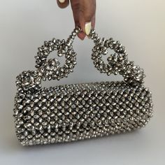 The Georgia Silver Bag is not just an accessory; it’s a statement piece that promises to elevate your style and add a touch of sophistication to any outfit. Whether you’re attending a formal event or a casual gathering, this bag is versatile enough to complement any occasion. Designer Evening Bag With Detachable Handle, Chic Top Handle Shoulder Bag With Silver-tone Hardware, Designer Evening Box Bag With Top Carry Handle, Chic Silver Handheld Shoulder Bag, Chic Silver Shoulder Bag For Formal Occasions, Designer Box Satchel For Evening, Designer Box Bag With Top Carry Handle For Evening, Designer Box Bag With Top Carry Handle For Evenings, Chic Box Bag For Evening