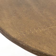 a close up view of a wooden table with rivets on the top and bottom