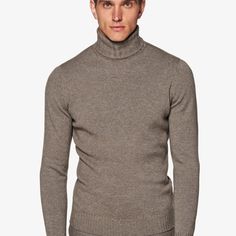 This soft taupe knitted sweater is
 tailored slim with a ribbed hem and cuffs, and heavy turtleneck collar. Elegant Fitted Sweater For Business Casual, Elegant Brown Winter Sweater, Elegant Brown Sweater For Winter, Classic Solid Color Formal Sweater, Classic Solid Sweater For Formal Occasions, Elegant Beige Turtleneck For Winter, Elegant Beige Winter Turtleneck, Formal Fitted Solid Color Sweater, Brown Winter Sweater For Business Casual