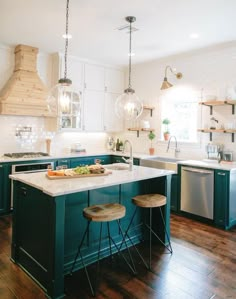 the instagram page shows an image of a kitchen with blue cabinets and white counter tops