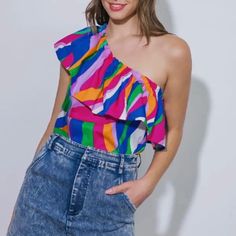 This Pop Of Color Top Is Perfect For Warm Weather. The Elastic Ruffle One Shoulder Design Allows You To Show Off A Tan Or Maybe A Tattoo! The Top Is 100% Cotton, Meaning It's Washable And Comfortable And Has No Stretch In The Fabric. We Love It Paired With Jeans Or Jean Shorts, Give It A Front Tuck! It Also Looks Great With A Wide Leg White Pant. 24" Length Trendy One-shoulder Blouse For Summer, Trendy One-shoulder Summer Blouse, Trendy One-shoulder Pink Top, Trendy Pink One-shoulder Top, Chic Multicolor One-shoulder Top, Chic One-shoulder Multicolor Top, Vibrant Pink Summer Tops, Multicolor Summer Blouse For Party, Fitted Multicolor One Shoulder Top