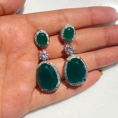 Green Emerald Jewelry Featuring semi precious green stones and cz diamonds. Perfect for any special occasion look or a wedding bridesmaid look. These Emerald Dangle Earrings surely add a touch of super luxury in your entire look. Also a perfect gift for her or gift for mom. *𝐏𝐑𝐎𝐃𝐔𝐂𝐓 𝐃𝐄𝐓𝐀𝐈𝐋* * 𝐌𝐚𝐭𝐞𝐫𝐢𝐚𝐥: Brass * 𝐏𝐥𝐚𝐭𝐢𝐧𝐠: White Rhodium Plated * 𝐒𝐭𝐨𝐧𝐞: AAA-quality CZ diamond, Emerald. *𝐃𝐈𝐌𝐄𝐍𝐒𝐈𝐎𝐍𝐒* * 𝐖𝐞𝐢𝐠𝐡𝐭: 6 gm each * 𝐋𝐞𝐧𝐠𝐭𝐡: 4.3 cm * 𝐖𝐢𝐝𝐭? Green Hand Set Diamond Earrings, Green Hand-set Diamond Earrings, Anniversary Green Diamond Earrings, Elegant Green Jewelry With Pave Setting, Oval Earrings With Pave Setting For Wedding, Diamond White Bridal Earrings With Pave Setting, Oval Wedding Earrings With Pave Setting, Green Pave Setting Fine Earrings, Green Diamond Drop Earrings With Accents