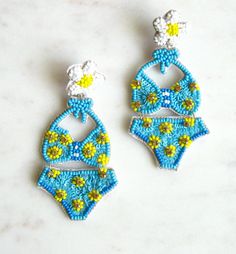 Bikini seed bead earrings - Blue and yellow Drop length 3 inches, width 1.5 inches Large dramatic statement earrings Back of the earring is white felt Summer earrings I fully guarantee all of my items. If you have any problems contact me and I will take care of your concerns. Please contact me with any questions. I am always glad to help. Cute Beaded Earrings For Summer, Playful Handmade Summer Earrings, Playful Handmade Earrings For Summer, Handmade Playful Earrings For Summer, Handmade White Beaded Earrings For Vacation, Beaded Jewelry For Beach Season Parties, Playful Beaded Summer Earrings, Playful Handmade Earrings For Beach, Summer Beaded Drop Earrings