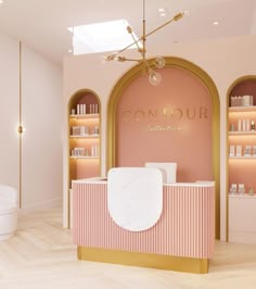 the interior of a salon with pink walls and gold trim