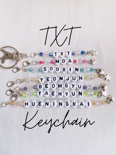 the key chain is made from plastic beads and has letters that spell it out in different languages