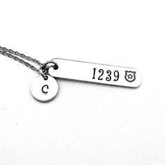 This hand stamped necklace makes a great gift for a Police Officer's girlfriend, wife or mom. This is also perfect for a anniversary or Valentine's Day present. The badge number and a police shield will be hand stamped on a 3/8 x 1 1/2" aluminum bar charm and includes an initial charm, a stainless steel lobster clasp and stainless steel cable chain.  *Please note that due to the nature of hand stamping we don't stamp on the back of our items. Thanks so much! Each letter has been individually han Engraved Dog Tag Jewelry For Birthday, Mother's Day Hand Stamped Dog Tag Jewelry, Hand Stamped Nameplate Jewelry For Anniversary, Hand Stamped Nameplate Jewelry For Anniversary Gift, Hand Stamped Dog Tag Jewelry As Gift, Hand Stamped Dog Tag Jewelry For Anniversary, Hand-stamped Dog Tag Jewelry Gift, Stamped Dog Tag Jewelry For Gift, Anniversary Stainless Steel Necklace