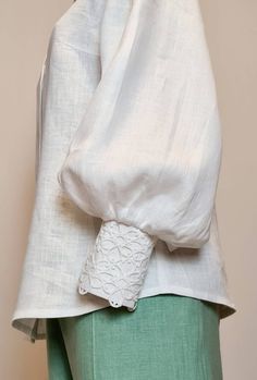 "Linen Blouse of a semi-adjacent silhouette.   - Back with middle seam - Puff sleeves  - Wide cuff, fastened with 2 buttons - The neck is finished with a stand-up collar - Optionally, the model can be decorated with white or black lace on the left half of the front and on the cuffs. SIZE CHART: SIZE XS (mostly USA/CA-2, UK-4, AU/NZ-6, JAP-5, EU-32) Bust/Waist/Hips 80cm/60cm/88cm 31.5\"/25.2\"/34.5\" SIZE XS/S (mostly USA/CA-4, UK-6, AU/NZ-8, JAP-7, EU-34) Bust/Waist/Hips 84cm/64 cm/92cm 33\"/26.5\"/36.2\" SIZE S (mostly USA/CA-6, UK-8, AU/NZ-10, JAP-9, EU-36) Bust/Waist/Hips 88cm/68cm/96cm 34.5\"/28.5\"/37.7\" SIZE M (mostly USA/CA-8, UK-10, AU/NZ-12, JAP-11, EU-38) Bust/Waist/Hips 92cm/72cm/100cm 36.2\"/30\"/39.5\" SIZE L (mostly USA/CA-10, UK-12, AU/NZ-14, JAP-13, EU-40) Bust/Waist/Hips Elegant Peasant Top With Balloon Sleeves, Chic Peasant Top With Bishop Blouson Sleeves, Chic Peasant Top With Blouson Bishop Sleeves, Fitted Peasant Top With Gathered Sleeves, Billowy Blouson Sleeve Puff Blouse, Fitted Puff Sleeve Top For Summer, Elegant Billowy Puff Sleeve Top For Summer, Elegant Balloon Sleeve Peasant Top, Feminine Peasant Top With Puff Sleeves