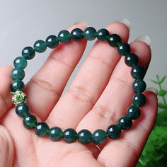 Product Details Product name: Jade bracelet Material: natural jade Shipping/Standard Handling and Shipping Requirements (15-30 days) Color: dark green Gloss: glass gloss Condition: Brand new Green Crystal Bracelet With Polished Beads, Green Jade Crystal Bracelet For Meditation, Green Jade Crystal Bracelet With 8mm Beads, Green Agate Round Crystal Bracelet, Green Jade Beaded Bracelets For Meditation, Green Round Beads Crystal Bracelet For Meditation, Green Agate Hand-strung Crystal Bracelet, Jade Bracelet, Natural Jade